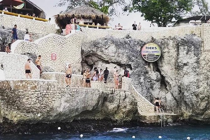 Bamboo Rafting and Limestone Foot Massage with Ricks Cafe Private Tour - Lethe Estate bamboo rafting: a hand-crafted 30-foot raft and a real captain