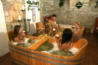 Prague: Bernard Beer Spa with Beer and Massage Option - Your private room setup: tub for the soak, heated bed for the cooldown